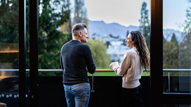 Couple on balcony queenstown